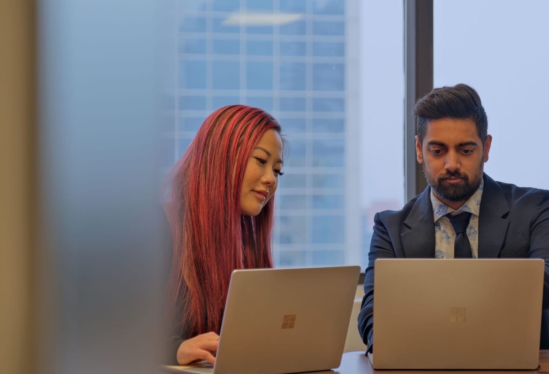 Bhardwaj + Co. lawyers reviewing a client matter at their downtown Edmonton office